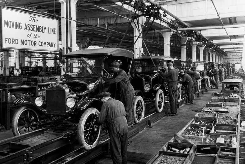 Historic Ford Model T assembly line showing mass-production manufacturing in the early automotive industry